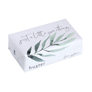 Huxter's Frangipani soap wrapped in 'Just a Little Something' with green leaves cover.