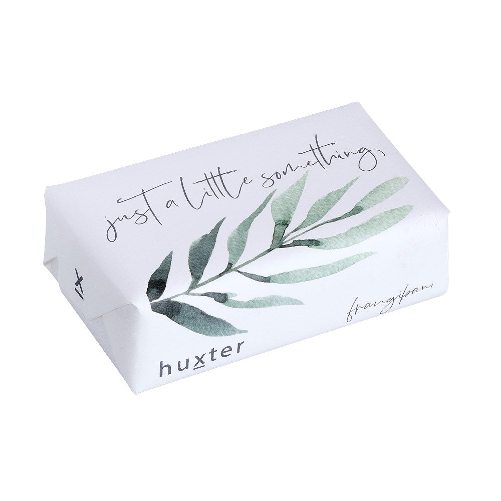 Huxter's Frangipani soap wrapped in 'Just a Little Something' with green leaves cover.