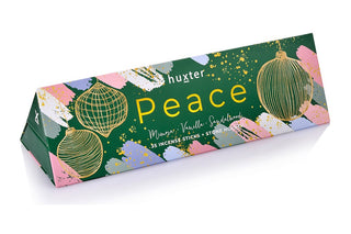 Huxter's Triangle bon bon green christmas baubles 'Peace' with 35 incense sticks inside, fragranced in mimosa, vanilla, and sandalwood