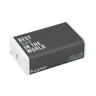 Huxter's Natural Basil, Lime, & Mandarin soap wrapped in 'Best Dad In The World' cover.