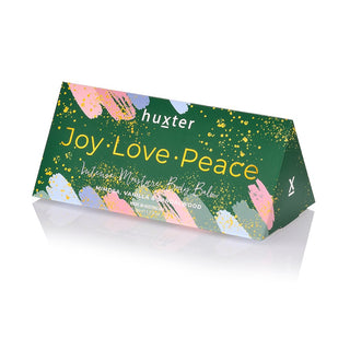 Huxter's 50gm body balm inside the triangle bon bon with Green  'Joy Love Peace' design and fragrance with mimosa, vanilla & sandalwood
